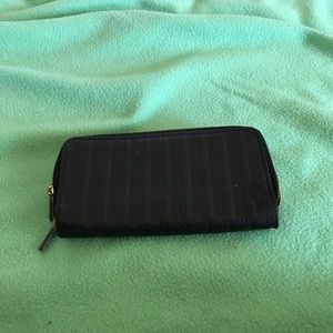 A black  wallet with a arm handle